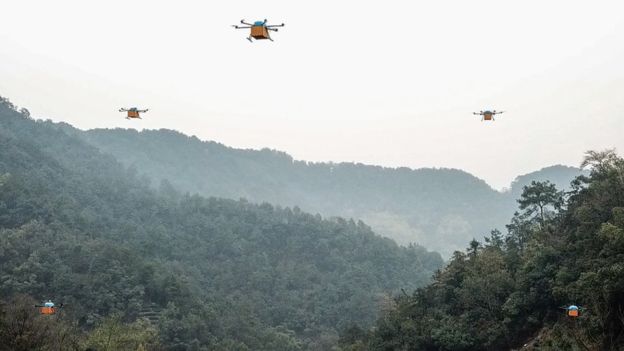 A fleet of drones transport tea leaves over mountainous Zhejiang Province in China