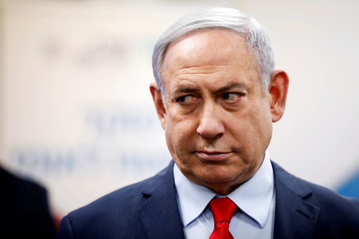 Israeli Prime Minister Benjamin Netanyahu looks on as he delivers a statement during his visit at the Health Ministry national hotline, in Kiryat Malachi, Israel March 1, 2020. REUTERS/Amir Cohen